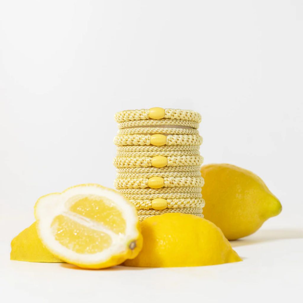KKNEKKI Slim woven hair tie in Light Yellow — close-up detail