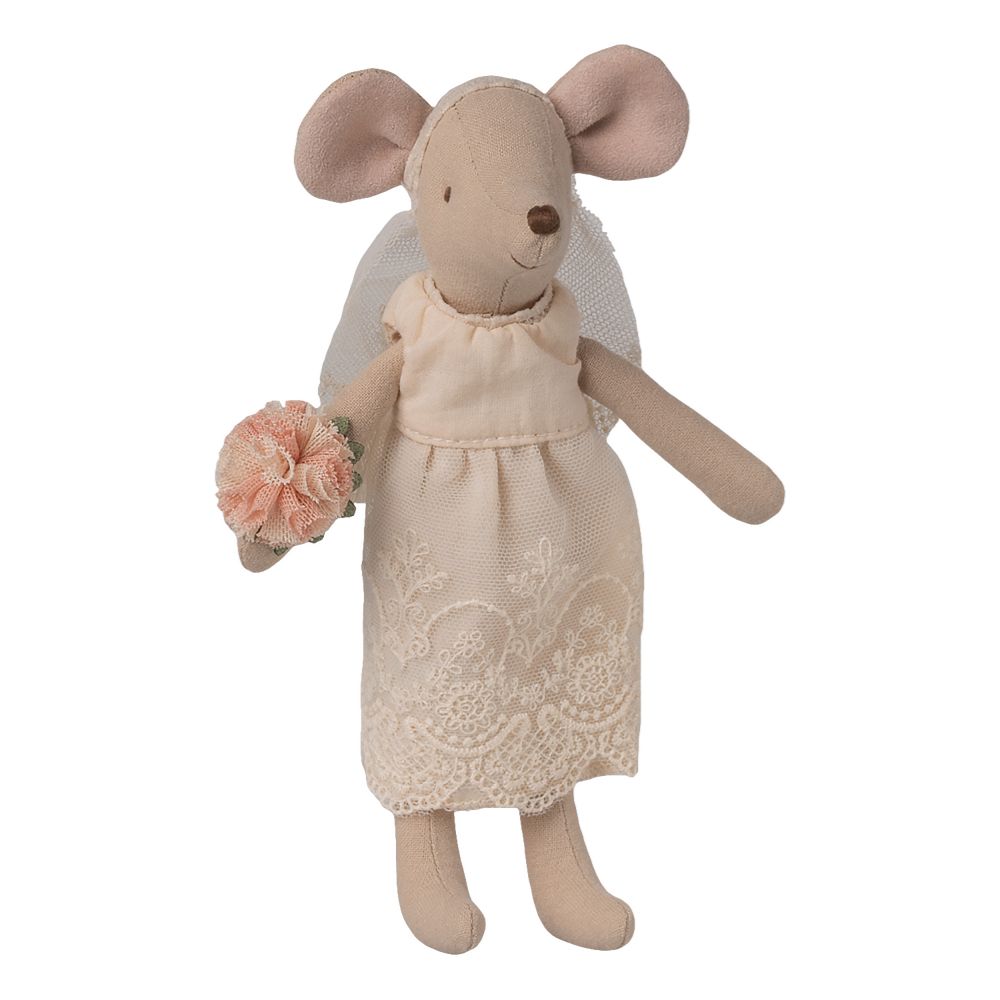 Stuffed mouse toy in a wedding dress holding a bouquet on a white background