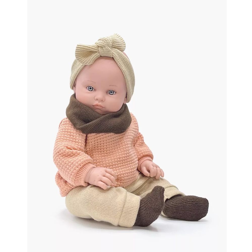 Minikane Bambinis Doll 47cm - Yaëlle dressed in her winter clothes with a pink knitted sweater