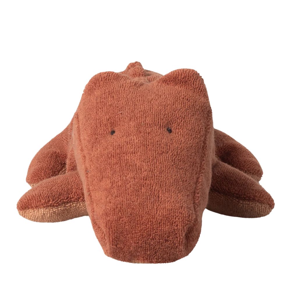 Brown plush toy on a white background