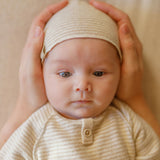 1 + in the Family METZ beige newborn footed sleeper in soft striped fleece with a button front