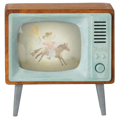 Vintage-style television with a fairy on a horse on its screen