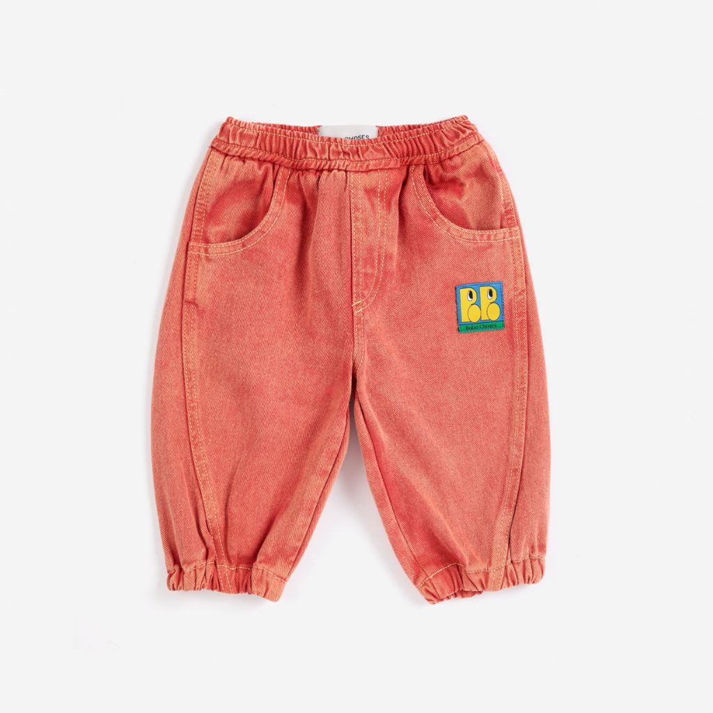 Bobo Choses Baby Tag denim pants in red organic cotton, five pocket cut, logo tag