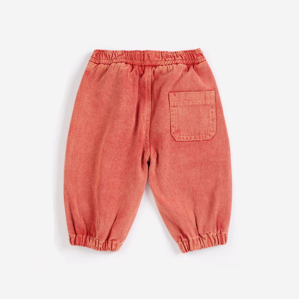 Bobo Choses Baby Tag denim pants in red organic cotton, five pocket cut, logo tag