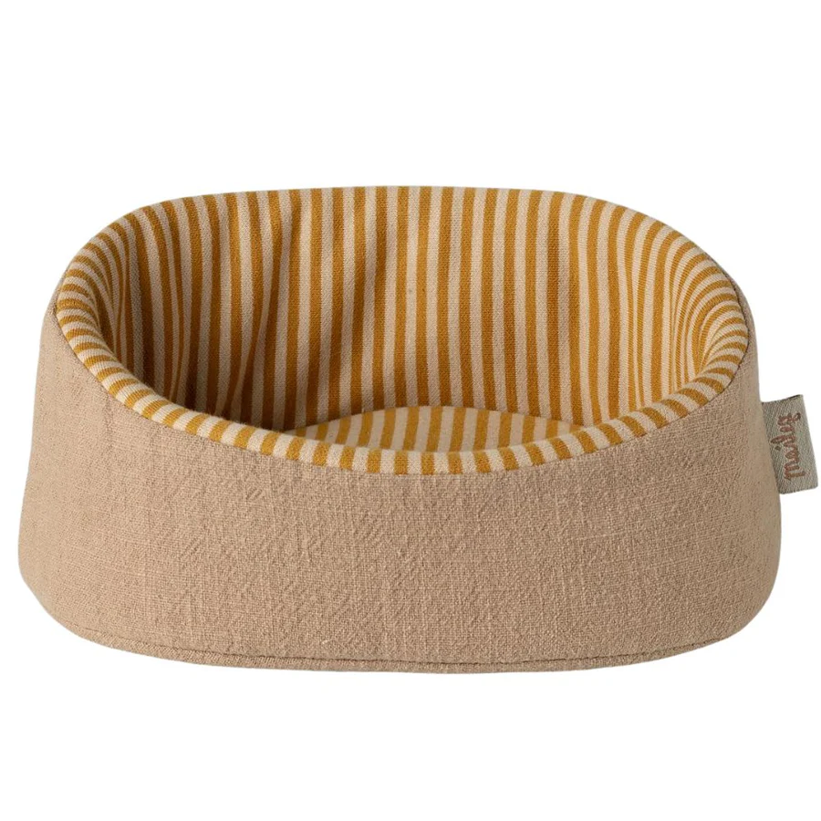 Pet bed with striped interior on a white background