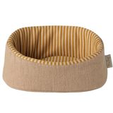 Pet bed with striped interior on a white background