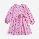 Bobo Choses Blossom woven dress in pink organic cotton, all over floral bloom print