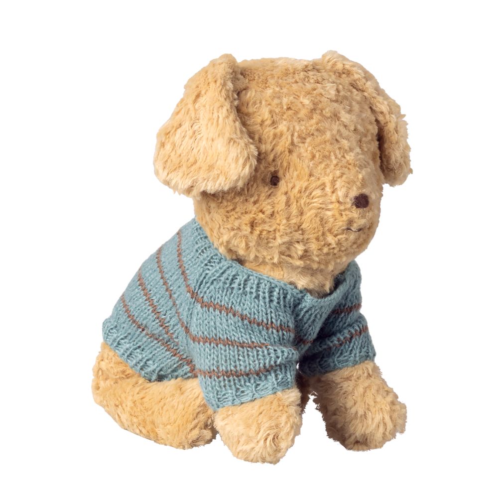 Stuffed dog toy wearing a blue striped sweater on a white background