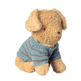 Stuffed dog toy wearing a blue striped sweater on a white background