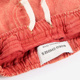 Bobo Choses Baby Tag denim pants in red organic cotton, five pocket cut, logo tag