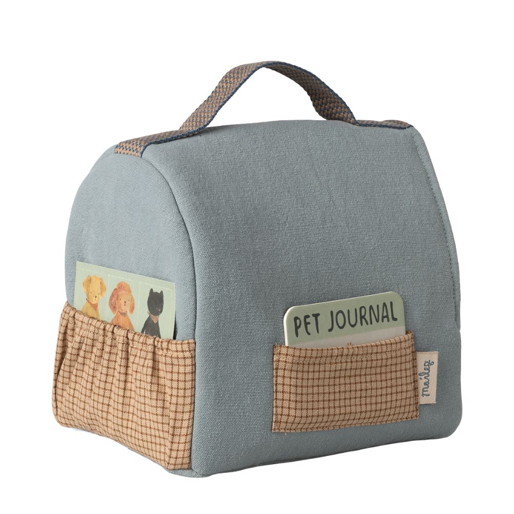Blue pet journal bag with pockets on a white background