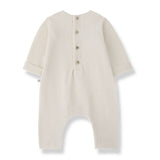 1 + in the Family MERIGNAC ivory newborn jumpsuit in soft capsule fleece with a ruffled collar